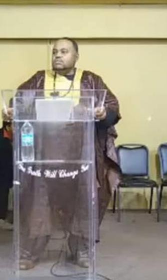 Mansa Sundiata Keita Kamara speaking at podium